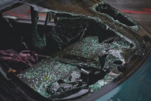 green-car-with-smashed-rear-windshield