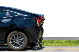 black car with rear end smashed in from a hit and run accident