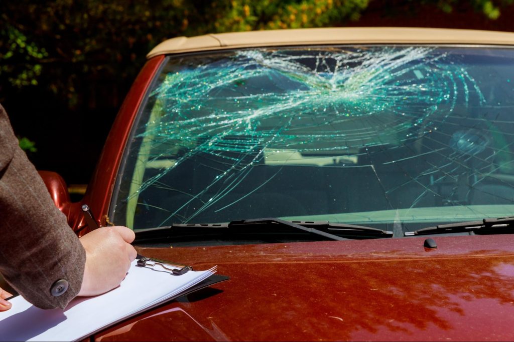 officer filling out an accident report at the scene of a wreck