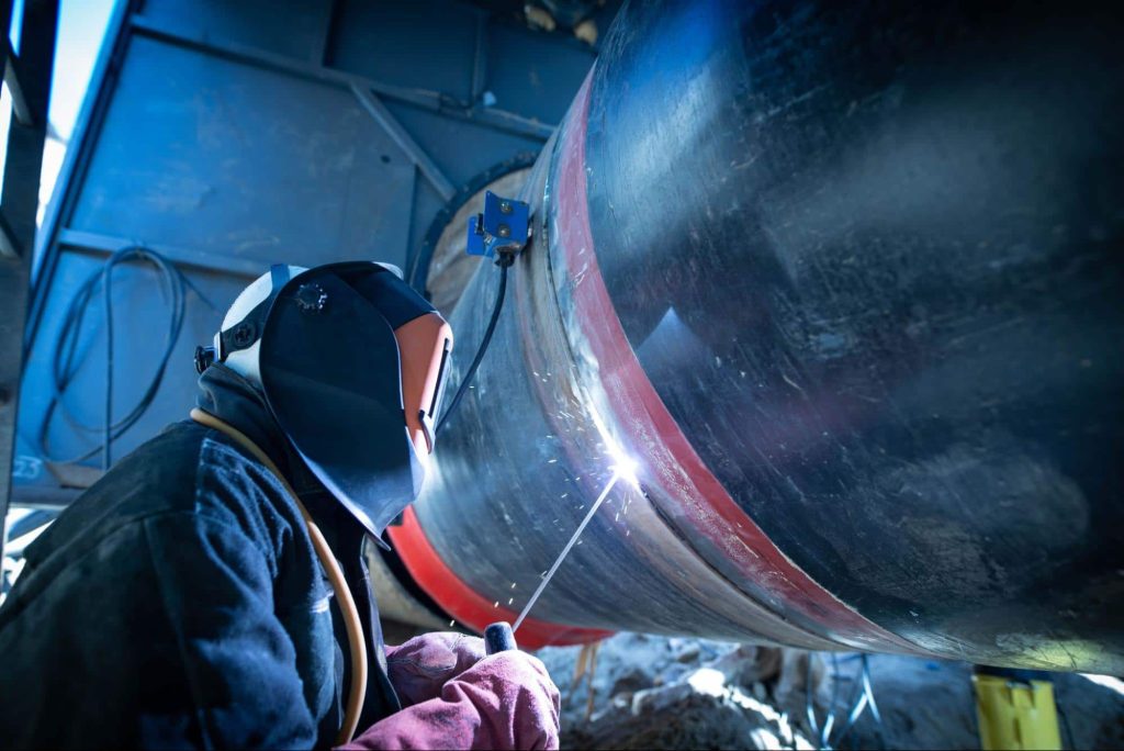 A welder welds together two metal pipes. If the welder were injured at work then workers compensation would cover those injuries.