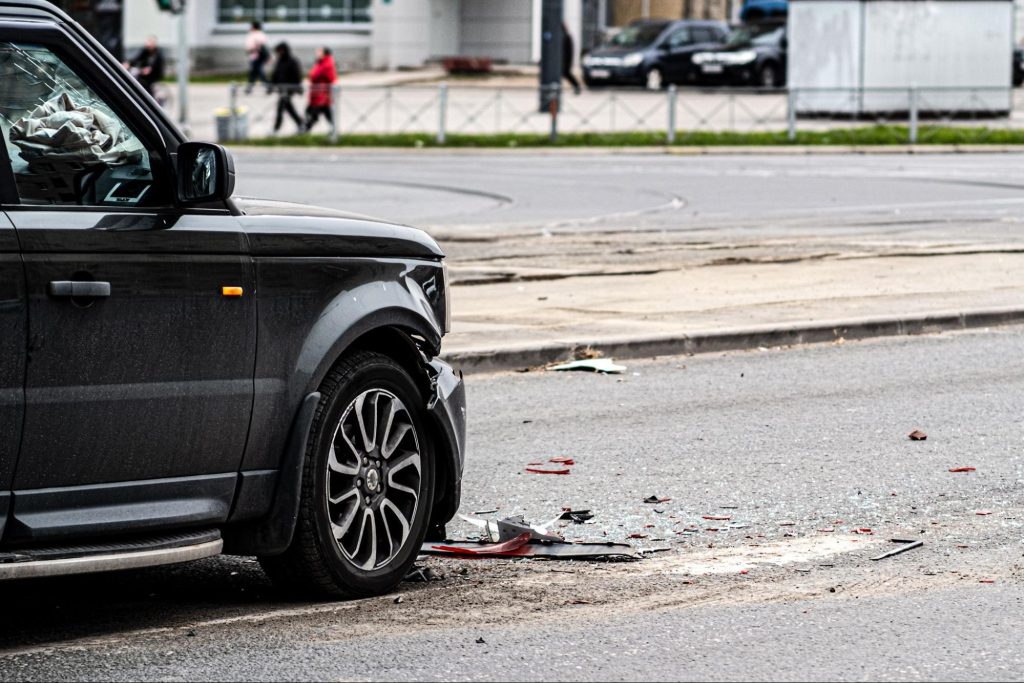 Crashed SUV on City Streets with Debris